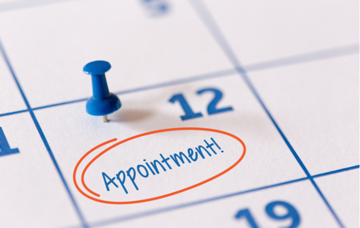 Calendar with "appointment" written on day of 12th as reminder